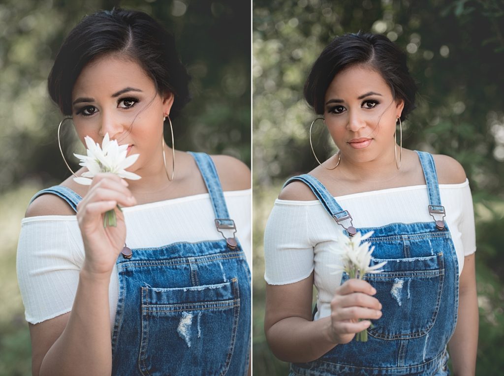 Cutests overalls and teen smelling flowers.